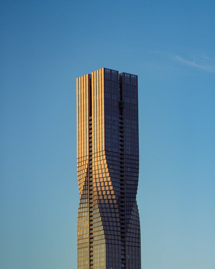 Captivating view of KARLATORNET skyscraper in Gothenburg against a clear sky during sunset.