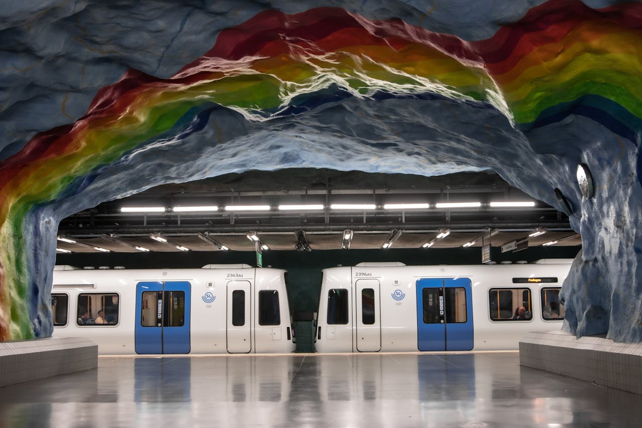 Vibrant rainbow mural at Stockholm metro station showcasing Scandinavian design.